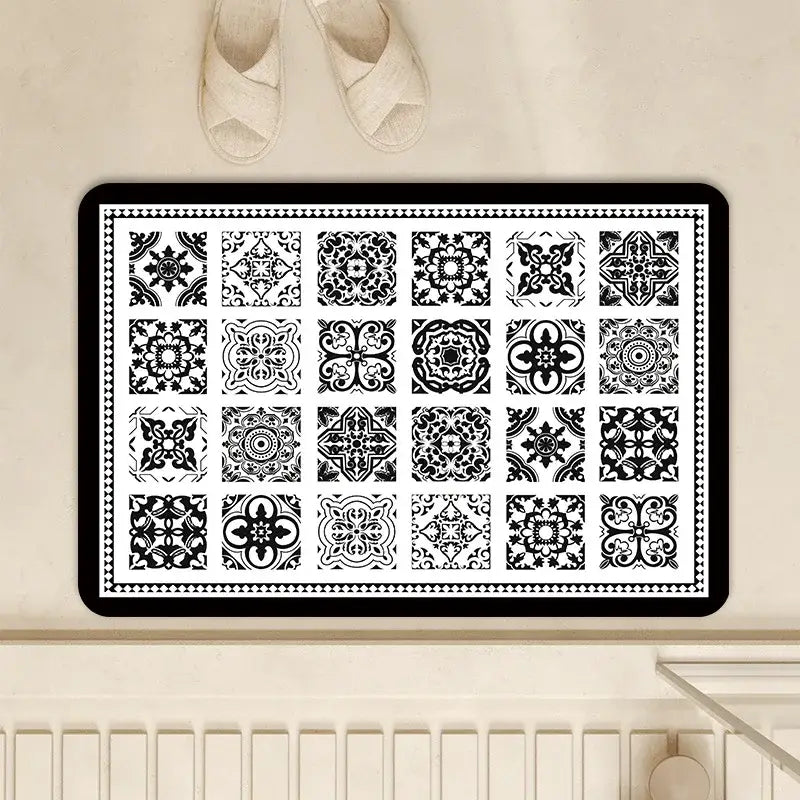 Black and white tiled-patterned absorbent bathroom mat with decorative border made of diatom ooze absorbent material