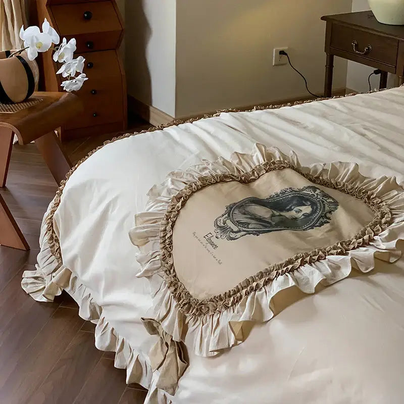 Beige heart-shaped bedding set with ruffled edges and vintage portrait print featuring decorbites french lace ruffles
