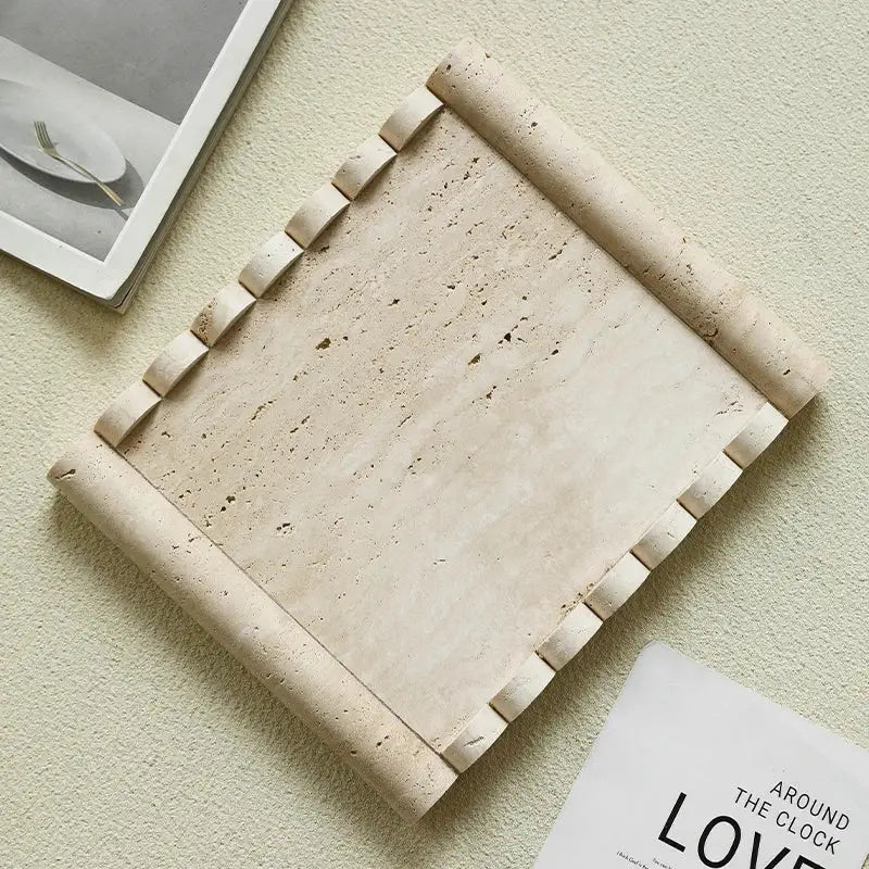 Beige travertine marble serving tray with rolled edges and textured natural surface for kitchen use