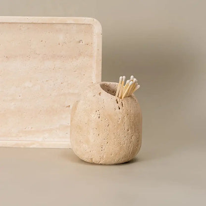 Beige travertine match holder with textured rustic organic shape for living room decor by decorbites