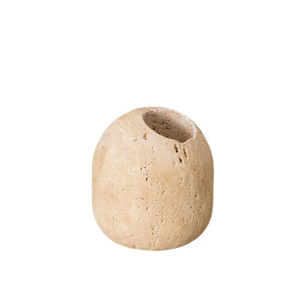 Beige travertine match holder with rounded organic shape and central opening vintage stone decorbites decor piece