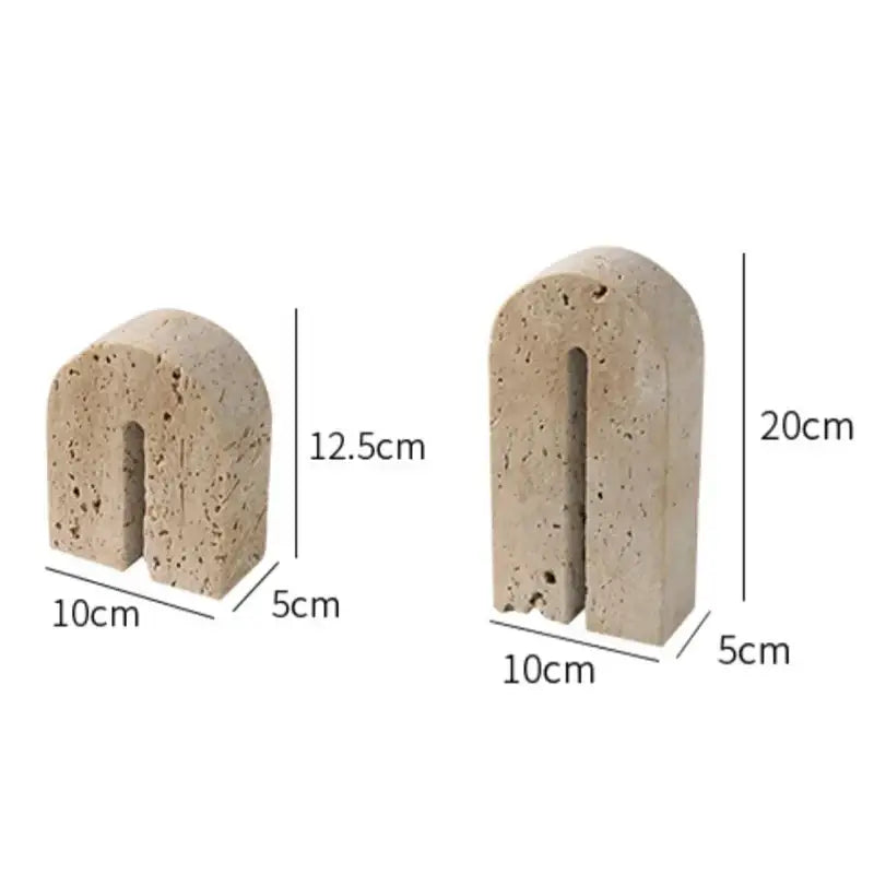 Beige travertine stone arched bookends with textured porous surface for vintage living room decor by decorbites