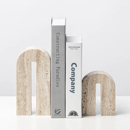 Beige travertine stone arched bookends with textured natural finish for living room decor by decorbites