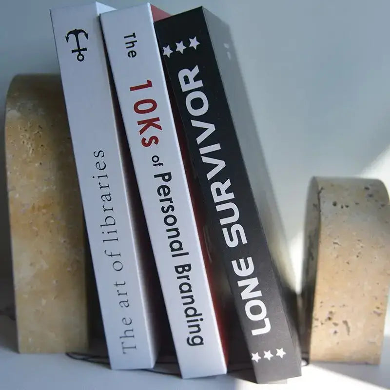 Vintage beige travertine stone arched bookends holding three books upright for living room decorbites beige travertine decor