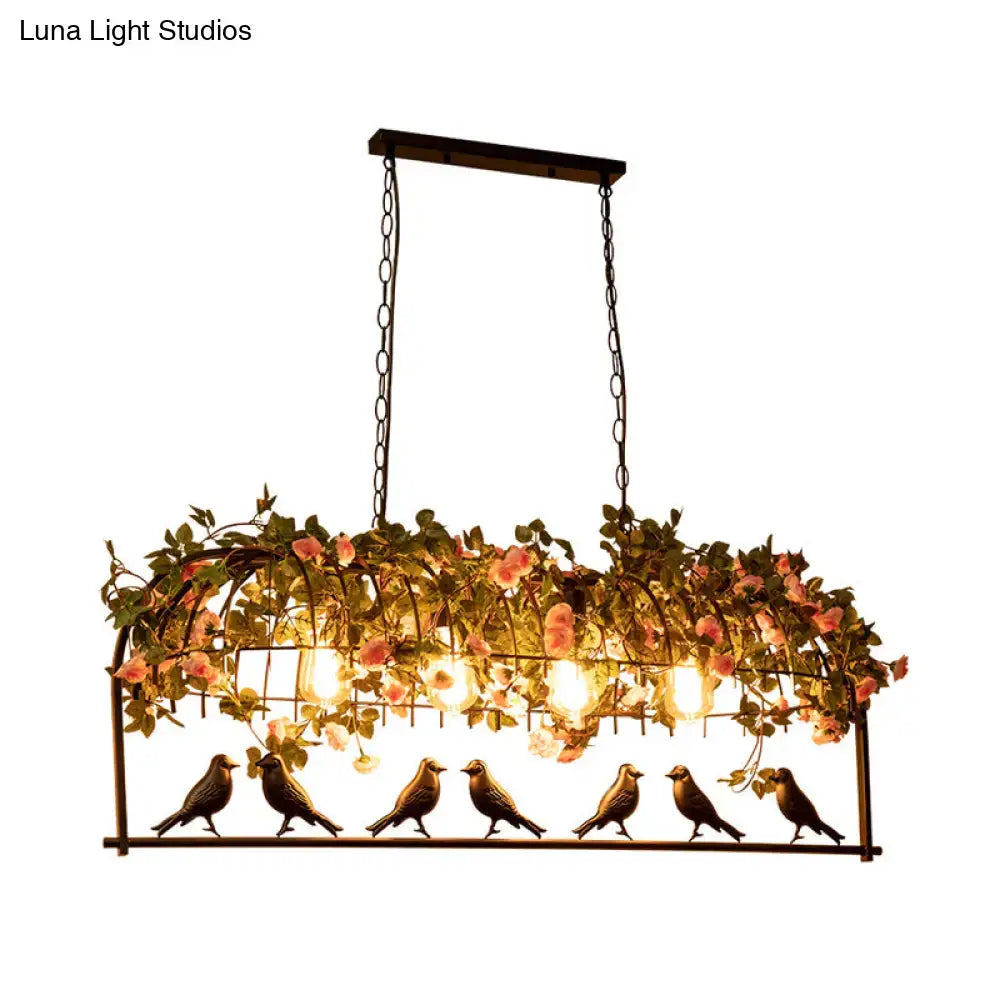 Vintage bird cage iron hanging light fixture with pink flowers green vines and six bronze bird figurines for dining room