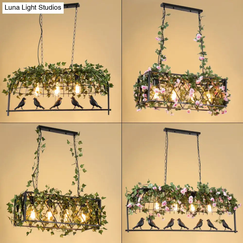 Black metal bird cage iron rectangular chandelier with hanging green ivy pink flowers and four exposed bulbs for dining room