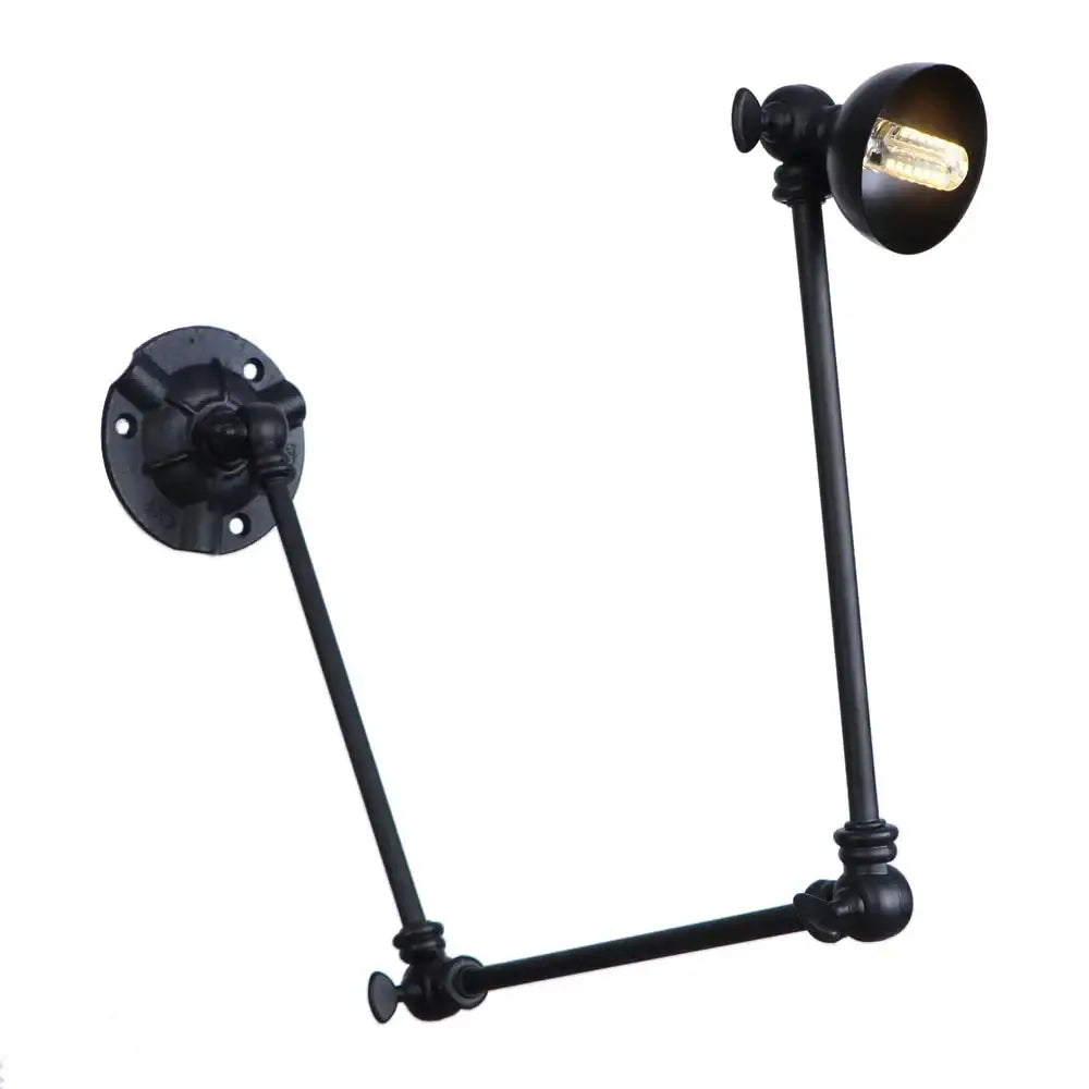 Vintage black adjustable loft wall light with articulated arms and vintage Edison bulb ideal for bedroom lighting