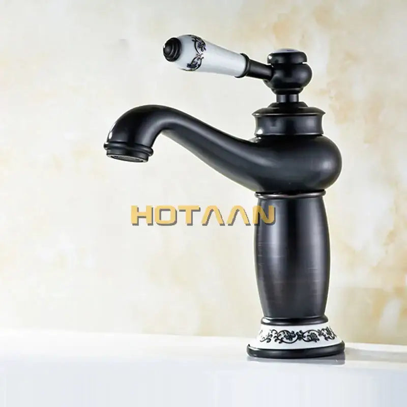 Vintage black brass ceramics bathroom faucet with black matte finish white floral ceramic handle and ornate base decorbites black brass