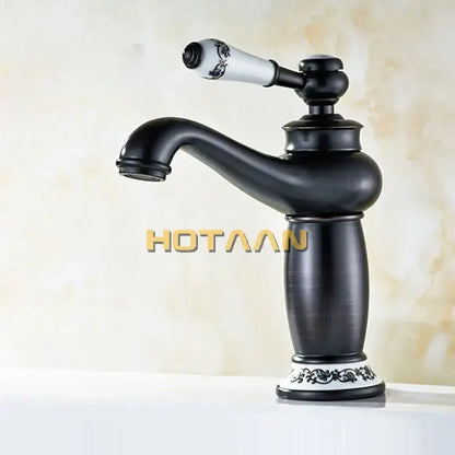 Vintage black brass ceramics bathroom faucet with black matte finish white floral ceramic handle and ornate base decorbites black brass