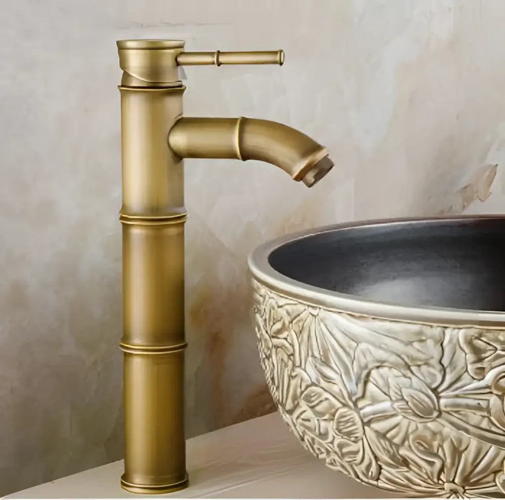 Brass vintage bathroom faucet with matte finish and bamboo-style segmented design for bathroom sink use