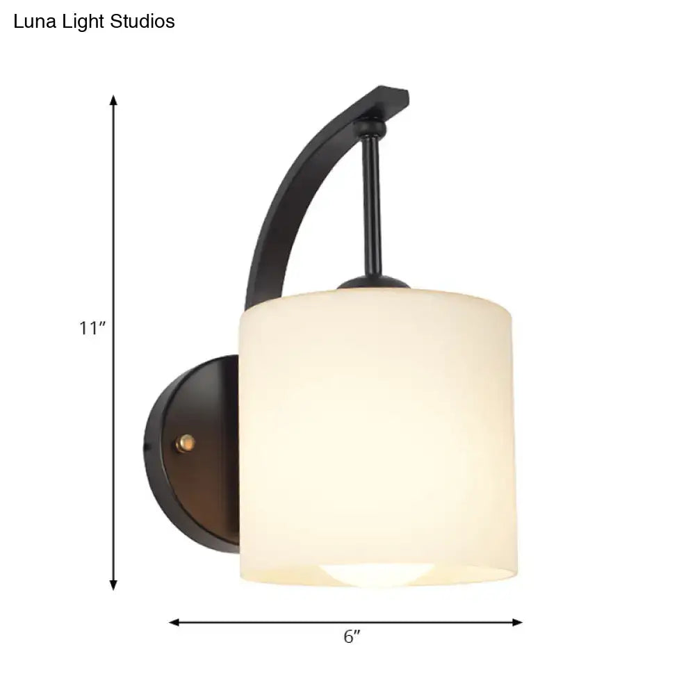 Vintage black metal wall lamp fixture type with curved arm and frosted off-white cylindrical glass shade e26 e27 bulb compatible