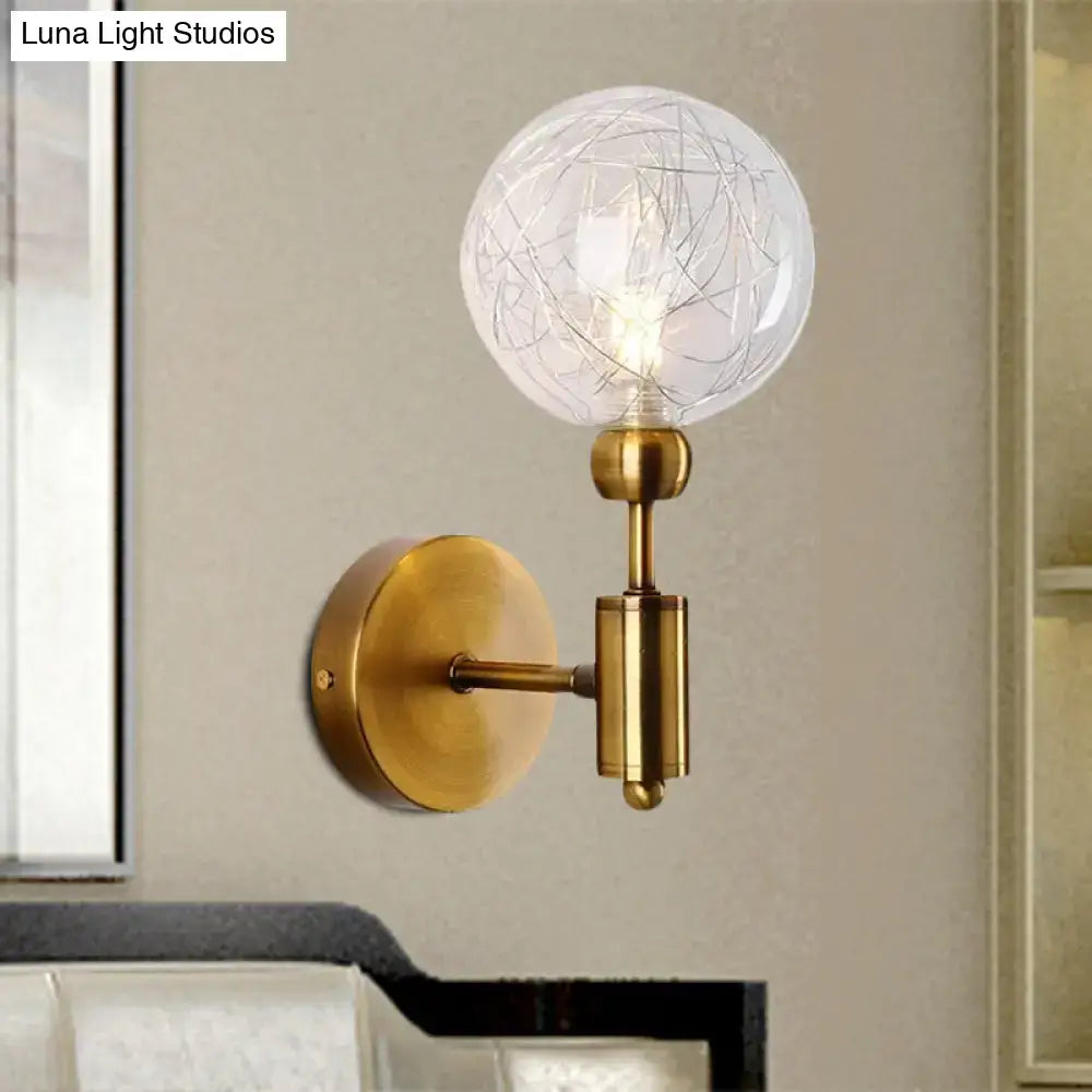Vintage black and gold clear glass wall sconce with brass finish e26 e27 socket and intricate wire detailing inside bulb