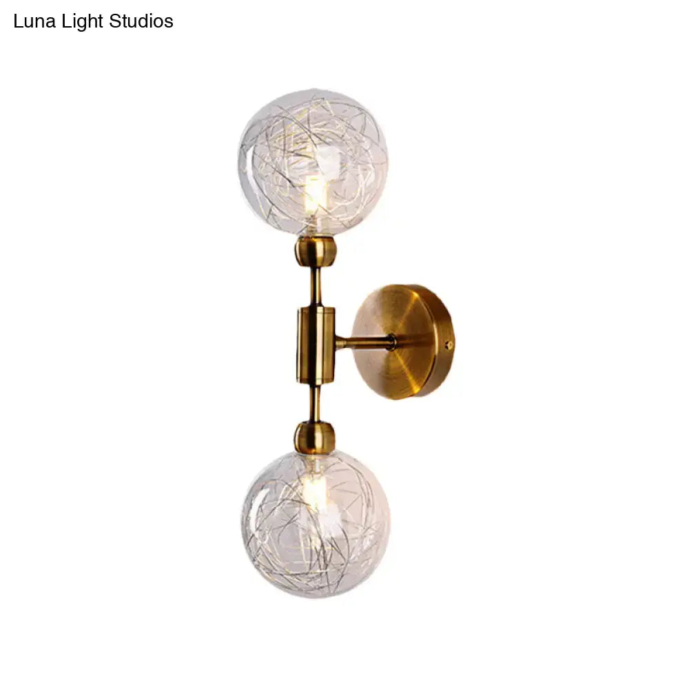 Brass-finished vintage wall sconce with two clear crackled glass globe shades for e26 e27 bulbs in bedroom use