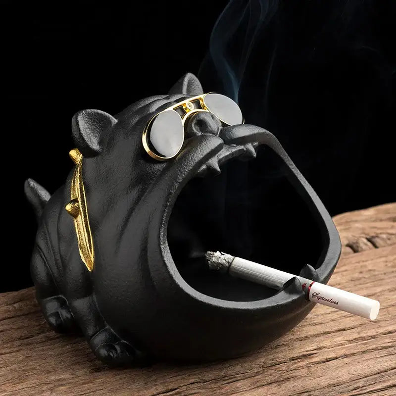 Vintage black and gold decorbites ceramic dog ashtray with gold sunglasses and lit cigarette for living room decor