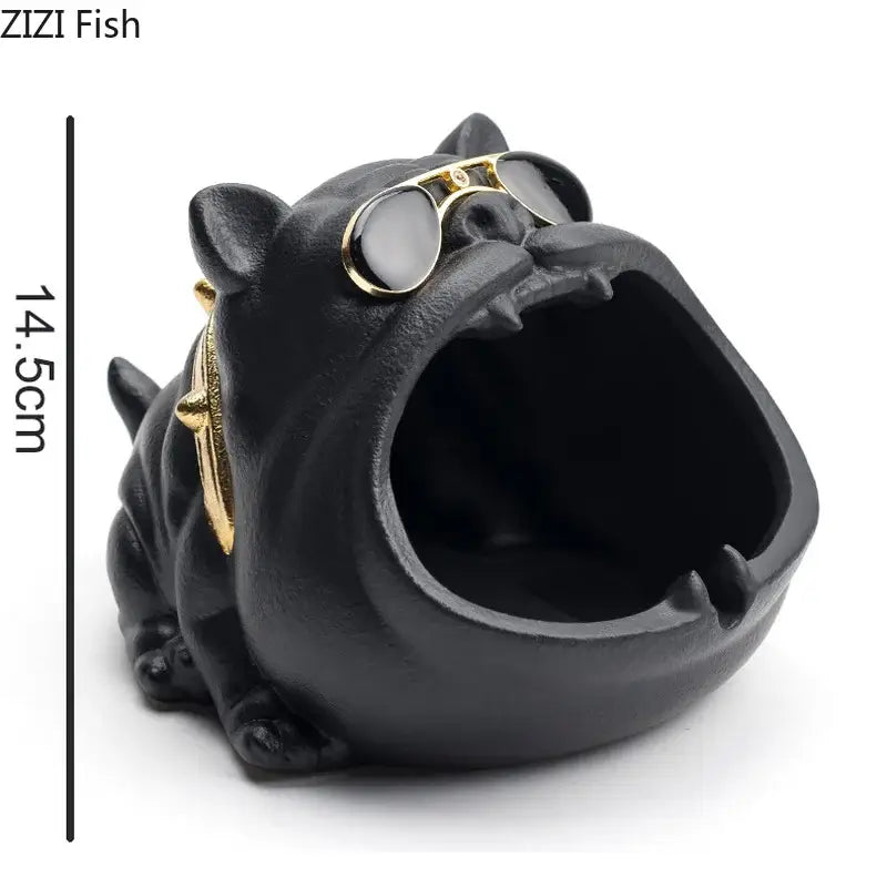 Vintage black and gold decorbites ceramic dog ashtray featuring a black ceramic bulldog with gold-rimmed sunglasses and collar