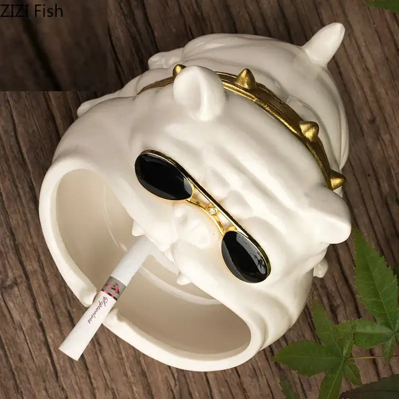 White ceramic dog ashtray with gold spiked collar and black sunglasses from decorbites ceramic dog collection for living room decor