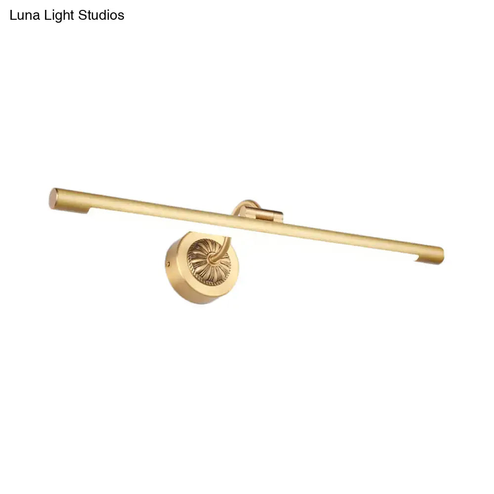 Vintage black gold wall light with gold finish, ornate circular base, and sleek elongated bar for bathroom vanity