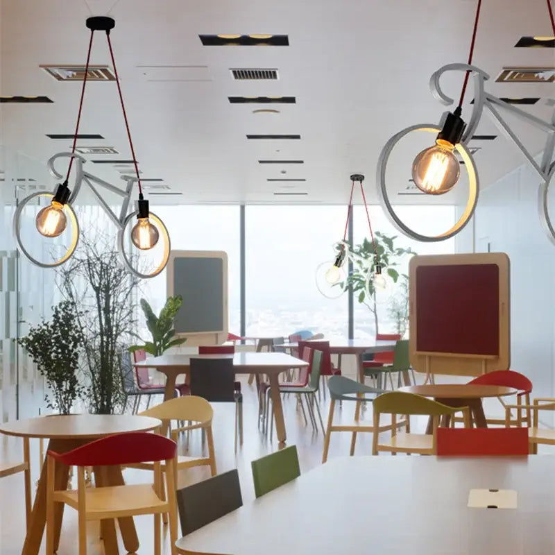White bicycle-shaped pendant lights with exposed filament bulbs and red cords in vintage black iron bicycle chandelier decorbites iron bicycle