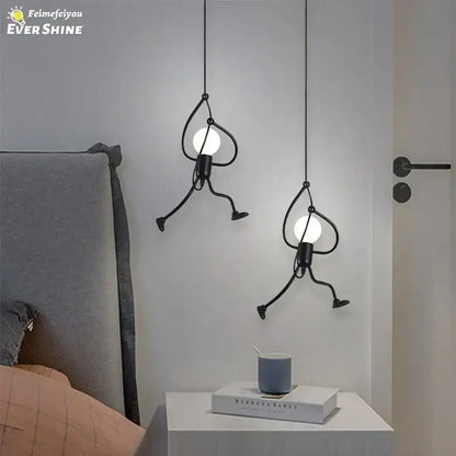 Vintage black man iron pendant light with cartoonish metal figures and glowing bulbs for bedroom decor pendant light