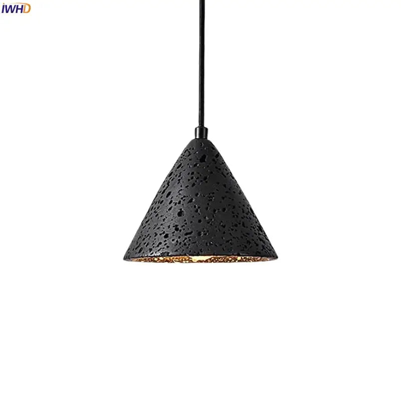 Vintage black travertine led pendant light with textured perforated exterior and warm gold interior for living room decorbites black travertine