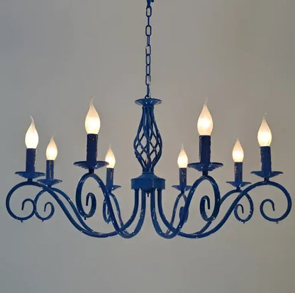 Vintage blue metal crystal chandelier with ornate scrollwork and candle-style bulbs for dining room decorbites blue metal