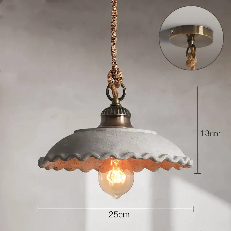 A rustic concrete pendant light with scalloped edge brass hardware and braided rope suspension for ceramic vintage hanging decorbites pendant lights