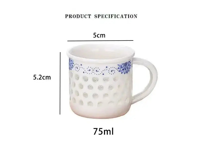 White ceramic tea cup set with blue floral dot patterns and perforated design for vintage dining room use