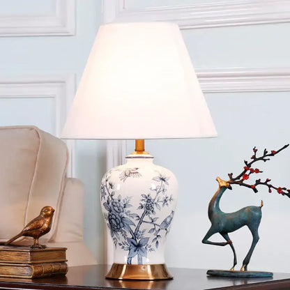 White porcelain table lamp with blue floral and bird patterns gold toned base perfect for decorbites blue white decor