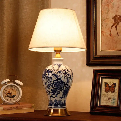 Vintage blue and white porcelain table lamp with intricate floral patterns and gold-toned base for decorbites blue white decor