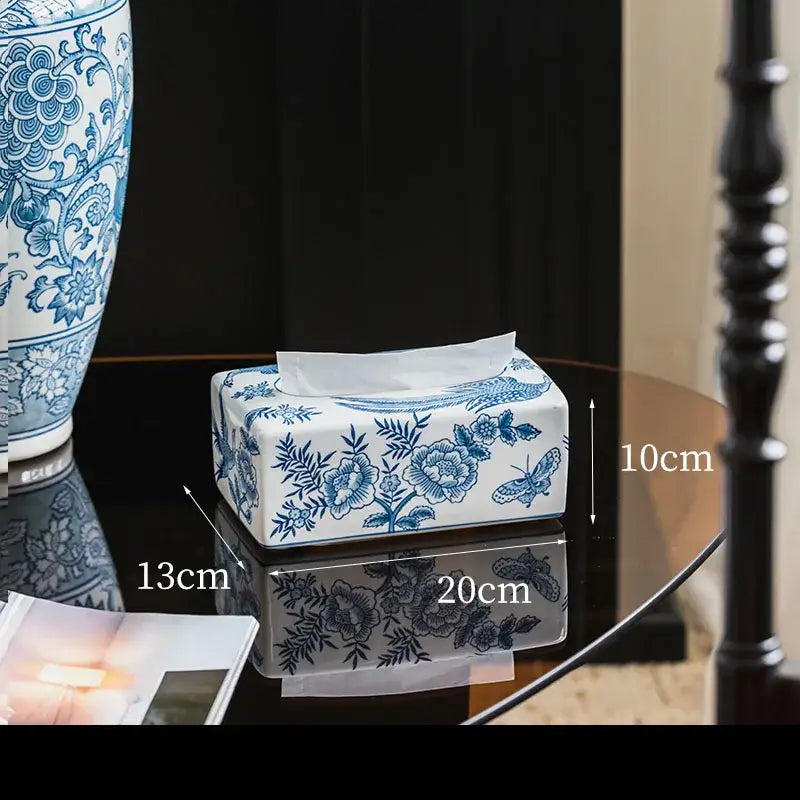 Vintage blue and white porcelain tissue box with floral and butterfly designs for living room decor