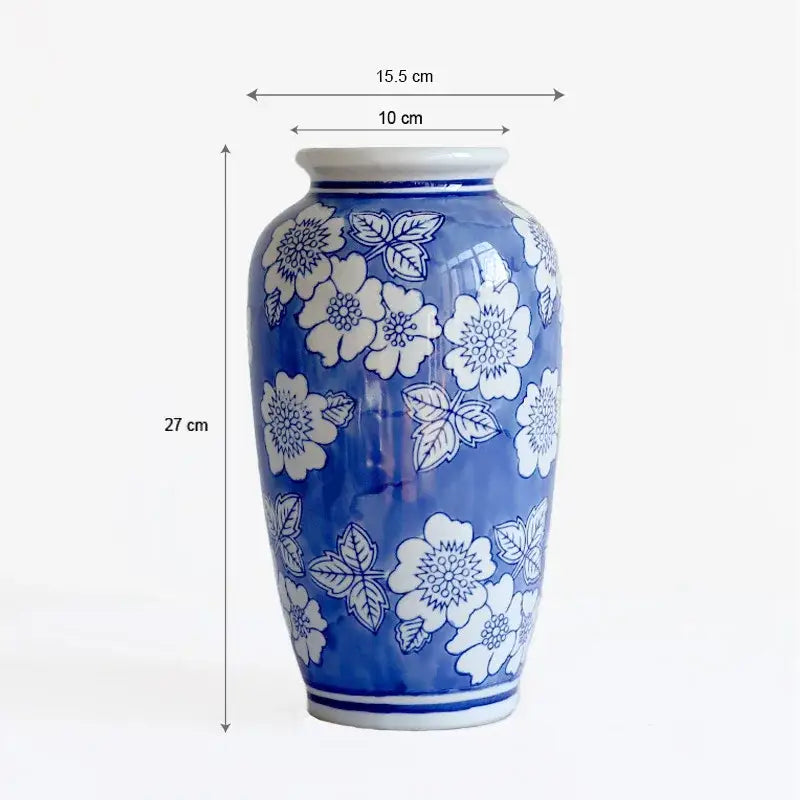 Vintage blue white porcelain vase with delicate floral patterns for living room decor by decorbites