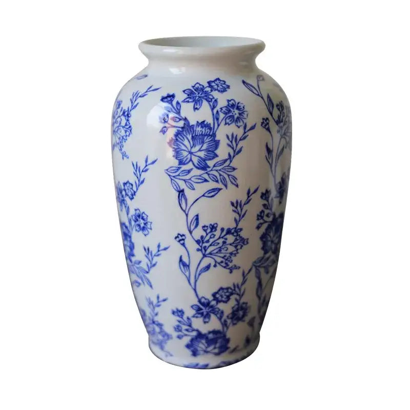 A vintage blue white porcelain vase with intricate floral patterns for living room decor by decorbites porcelain vase