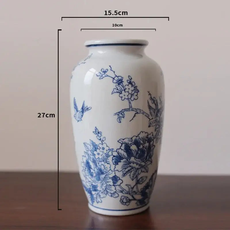 A vintage blue white porcelain vase with intricate floral and bird motifs for living room decorbites blue white decor