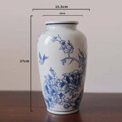 A vintage blue white porcelain vase with intricate floral and bird motifs for living room decorbites blue white decor