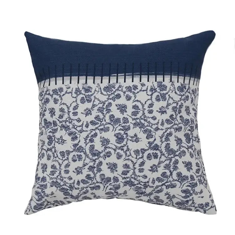 Square pillow cover with navy blue top and white bottom featuring dark blue floral pattern vintage decorbites blue tassel