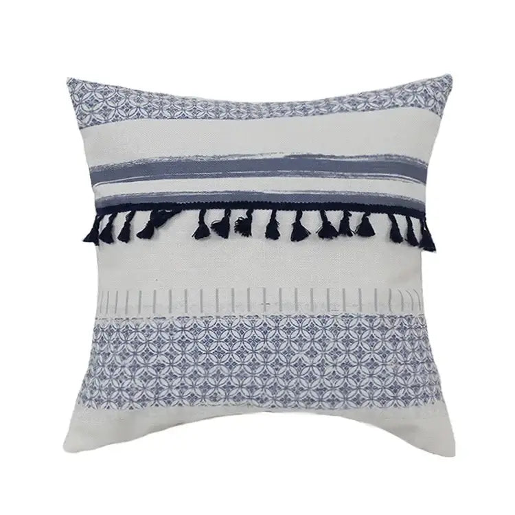 A square pillow cover with a white base, vintage blue tassel stripes, and navy tassels for living room decorbites decor