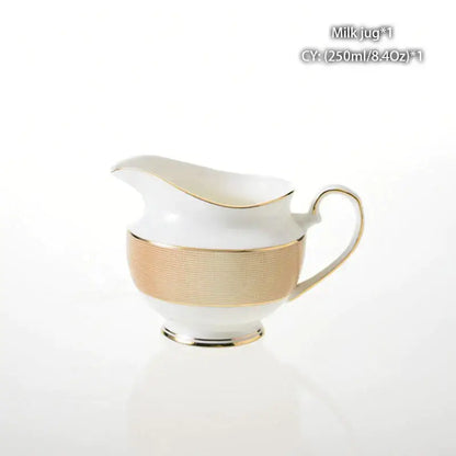 Vintage bone china milk jug with white porcelain, gold-trimmed handle, spout, and textured gold foil band decorbites bone china