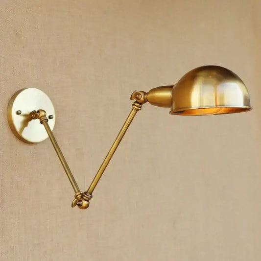 Vintage brass adjustable long arm wall light featuring a dome-shaped lampshade and decorative joints for bedroom decorbites adjustable long use