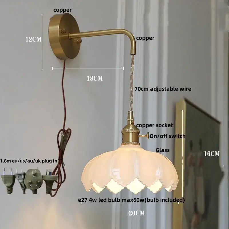 Antique brass-finished wall sconce with delicate petal-shaped amber coffee glass shade for bedroom LED light