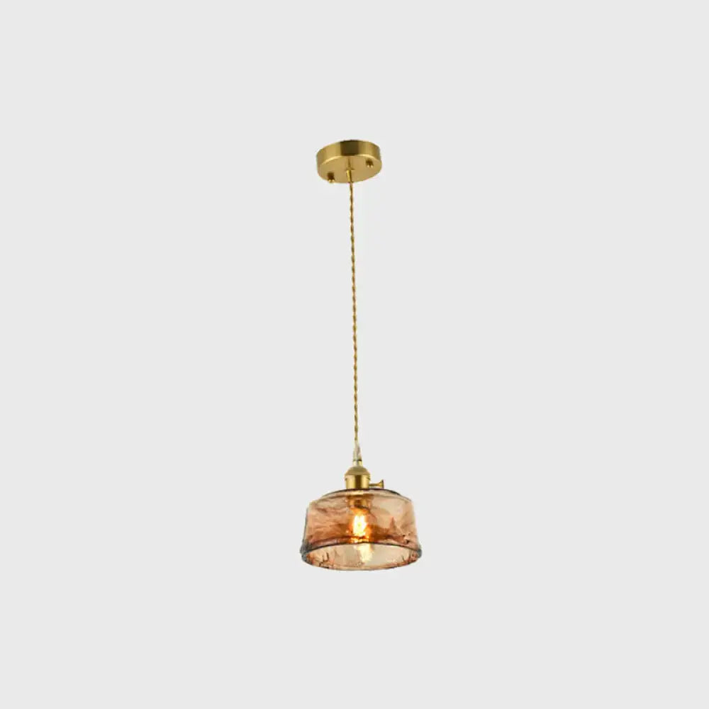 Decorbites™ brass shaded drop pendant light with amber tan glass and brass fixture for living room use