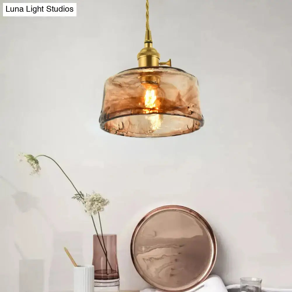 DecorBites™ brass shaded drop pendant light with warm amber tan glass and twisted cord for living room use