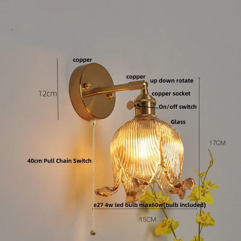 Vintage brass wall light with warm copper finish and loft amber glass shade in flower shape for bedroom decorbites loft amber