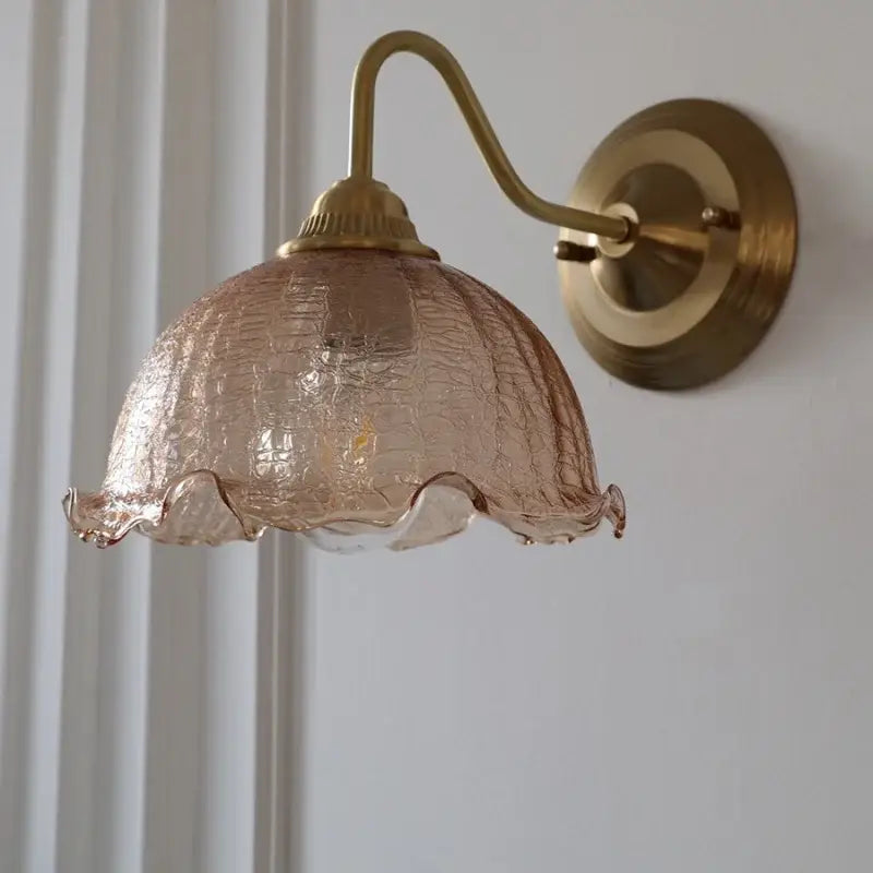 Vintage brass wall sconce with decorbites amber glass wall lampshade featuring a crackled finish and ruffled edge