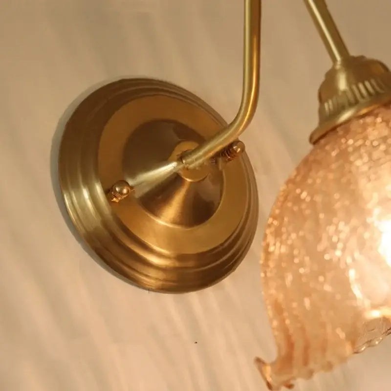 Vintage brass wall sconce with textured decorbites amber glass shade ideal for bedroom vanity amber glass wall lighting