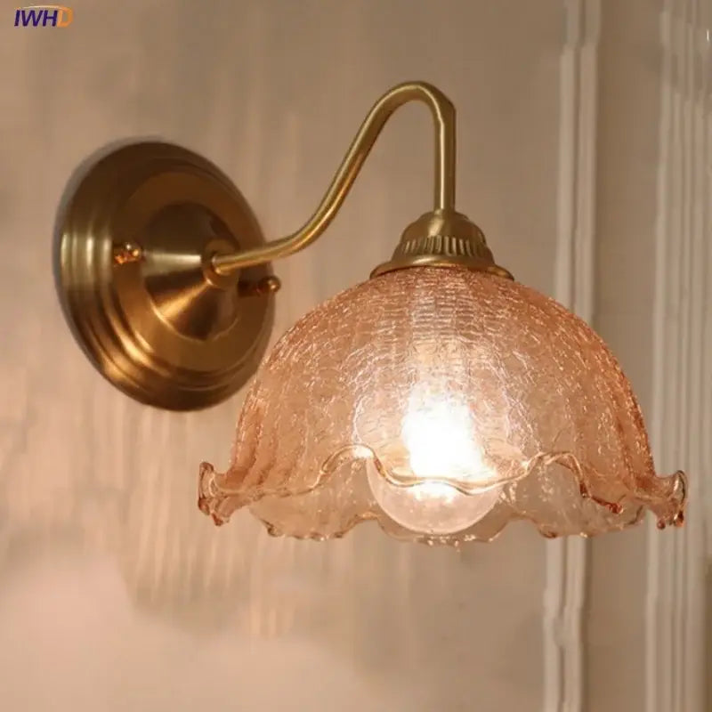 Vintage brass wall sconce with decorbites amber glass textured peach shade and ruffled edges for bedroom vanity light