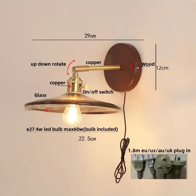 Vintage brass and amber glass wall sconce with copper and wood finish and pull chain switch for stair lighting
