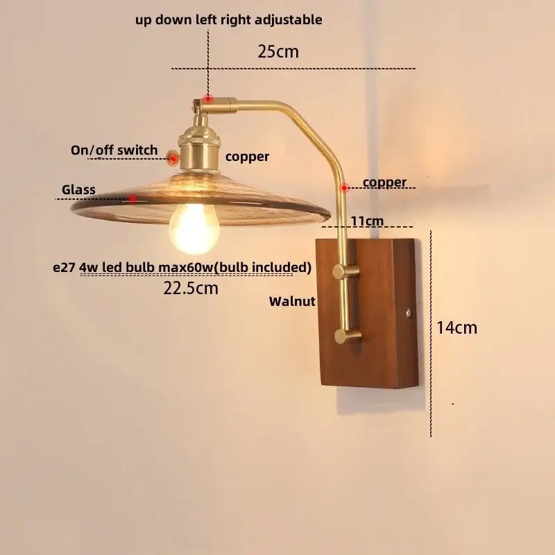 Vintage brass wall sconce with copper finish, amber glass shade, walnut wood base, and pull chain switch