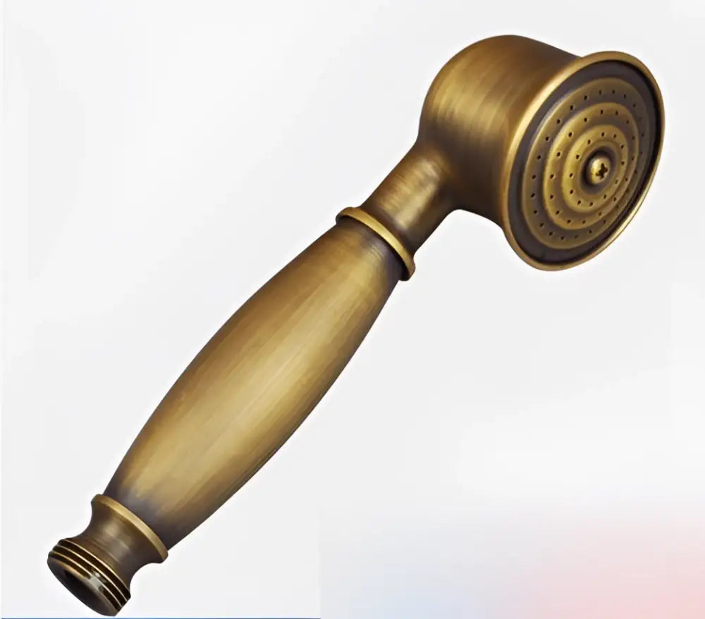 Antique brass-finished handheld shower head with classic rounded design and textured spray face for vintage bathroom fixture