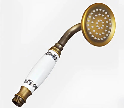 Vintage brass and ceramic handheld shower head with white ceramic and black floral detailing for bathroom use