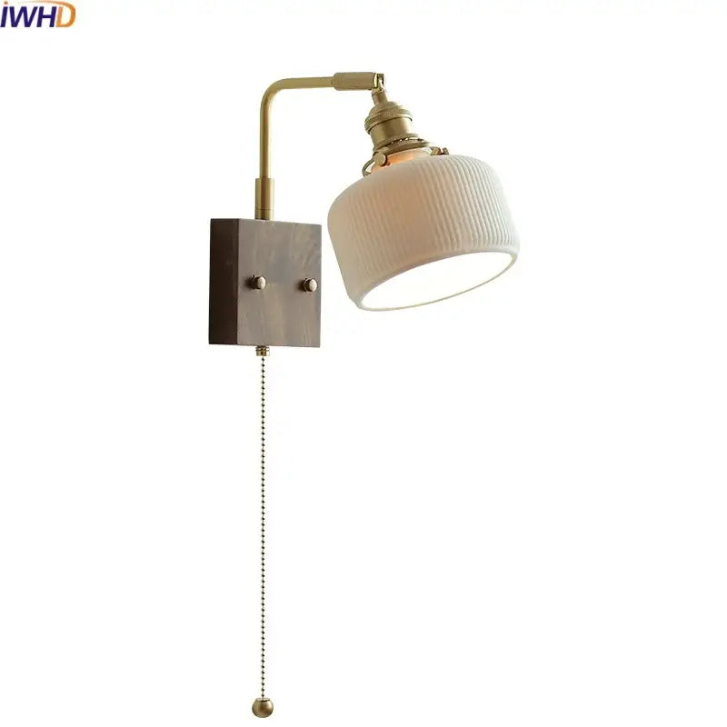 Vintage brass and ceramic led wall lights with ribbed off-white ceramic shade and wooden base for bedroom use